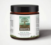 Adored Beast Primordial Pre & Probiotics Soil & Sea: A jar of supplements surrounded by soil and sea elements.